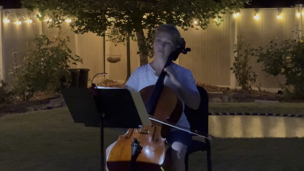 Dorothy performing a candlelight cello concert